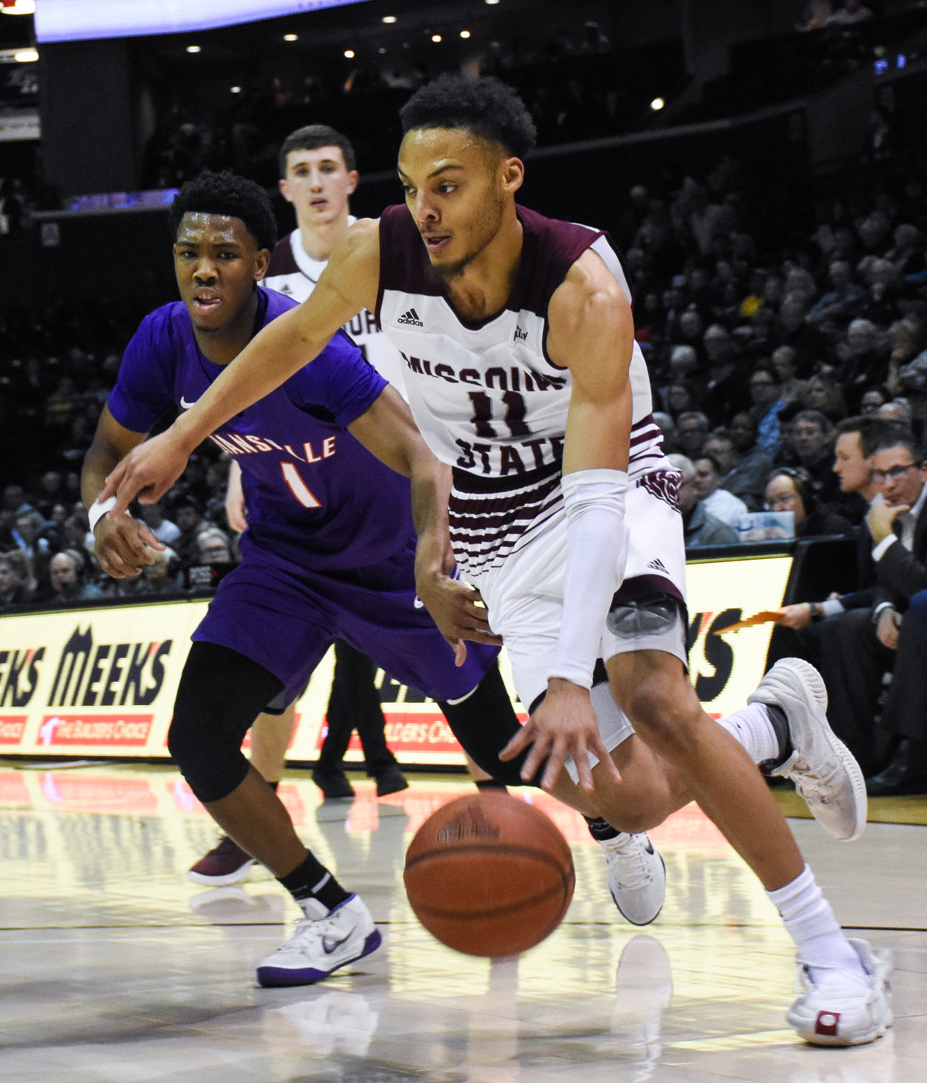 Jarred Dixon drives past his opponent